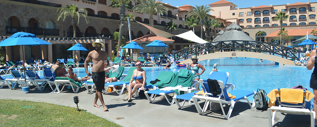 people enjoying the sun at royal solaris los cabos pool