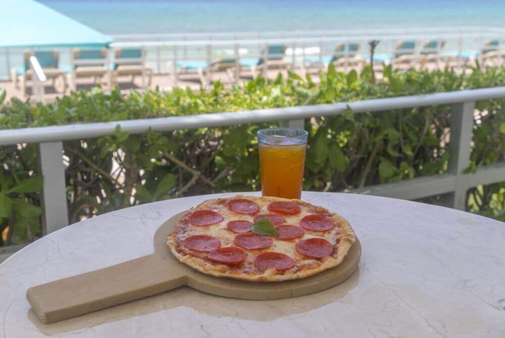 pepperoni pizza with cold tea